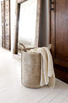Natural Jute Laundry Basket in bedroom with blanket