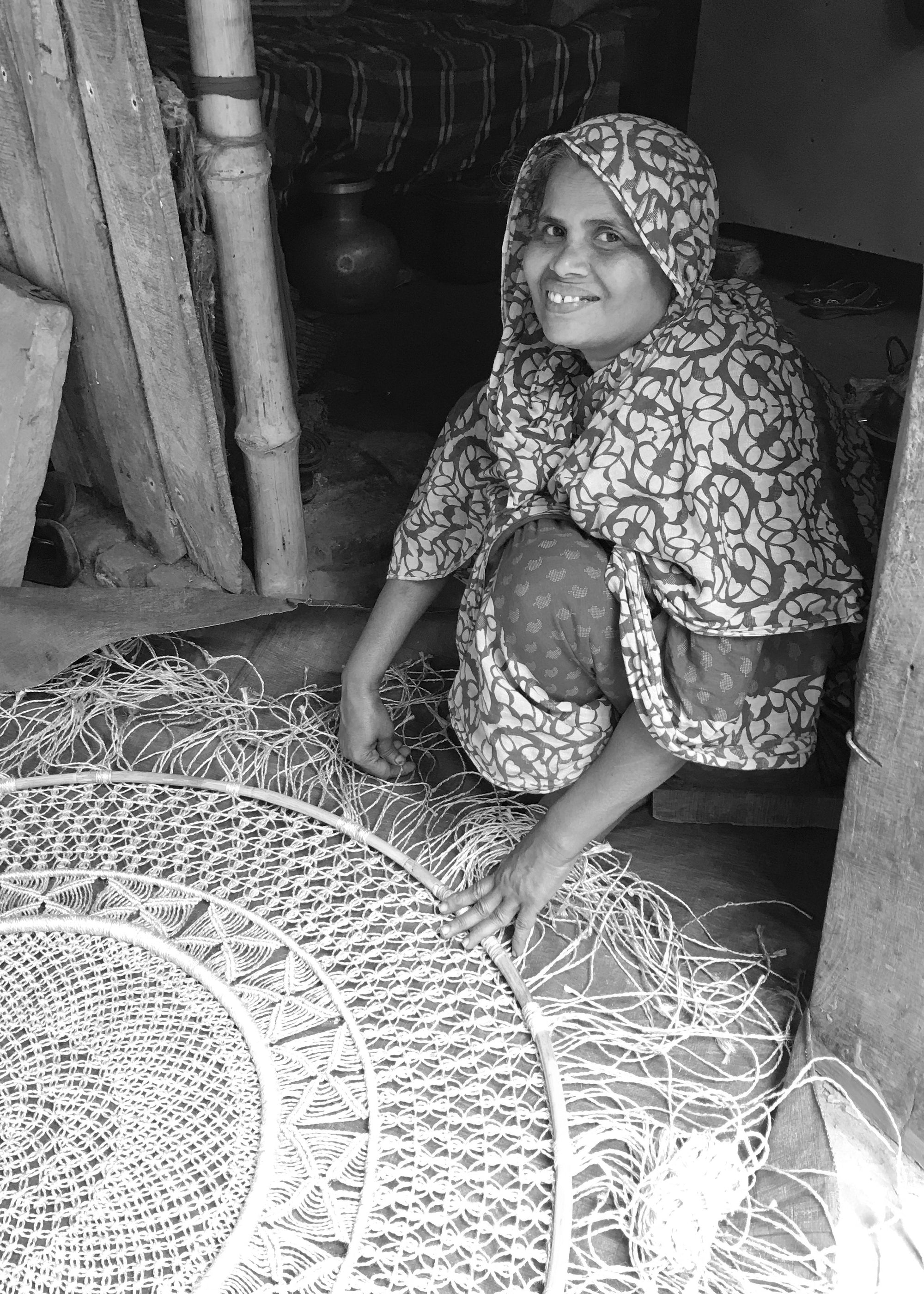 One of our Fair Trade artisans working on a handmade woven wall hanging